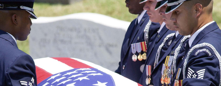 Airmen with flag-draped casket